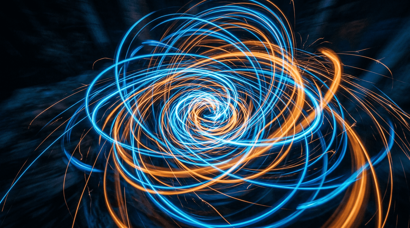 Spiral patterns of intertwined blue and orange light trails on dark background